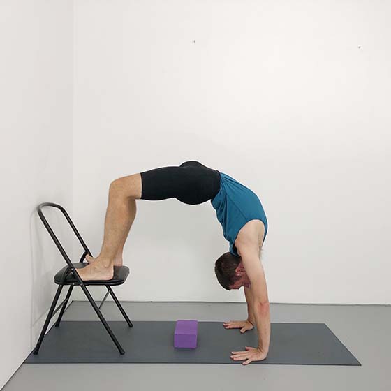 urdhva dhanurasana with feet on a chair