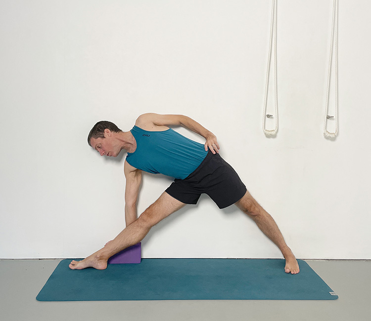 Resorative variation of trikoonasana (triangle pose)