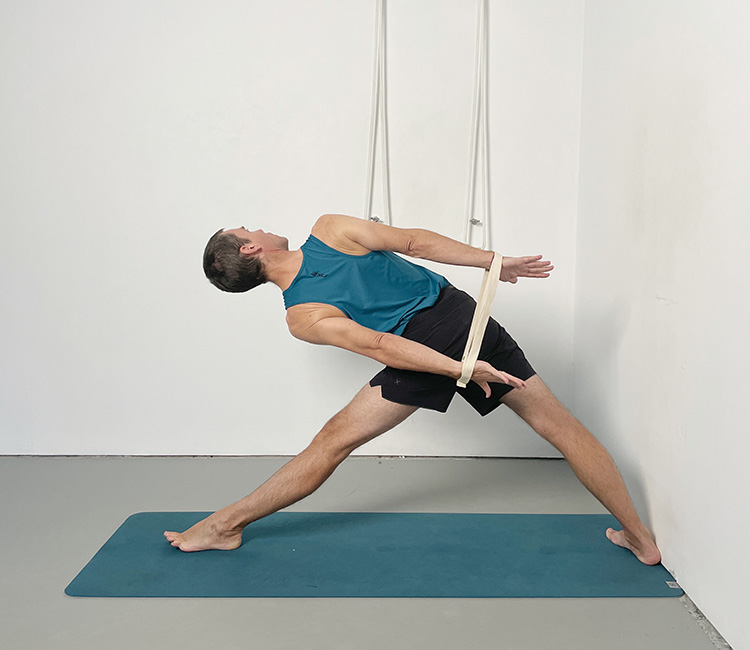 Trikonasana (triangle pose) with a belt
