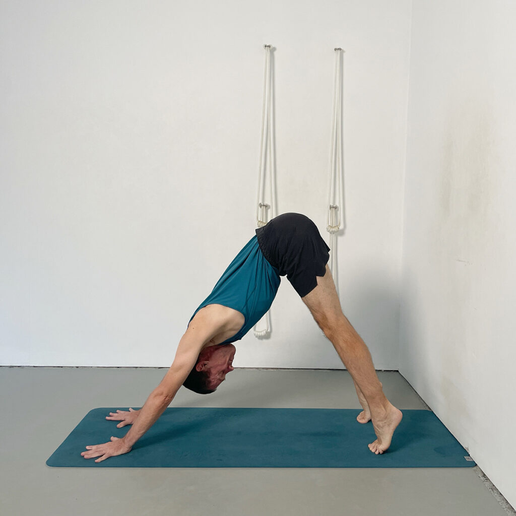 adho mukha svanasana modification with raised heels