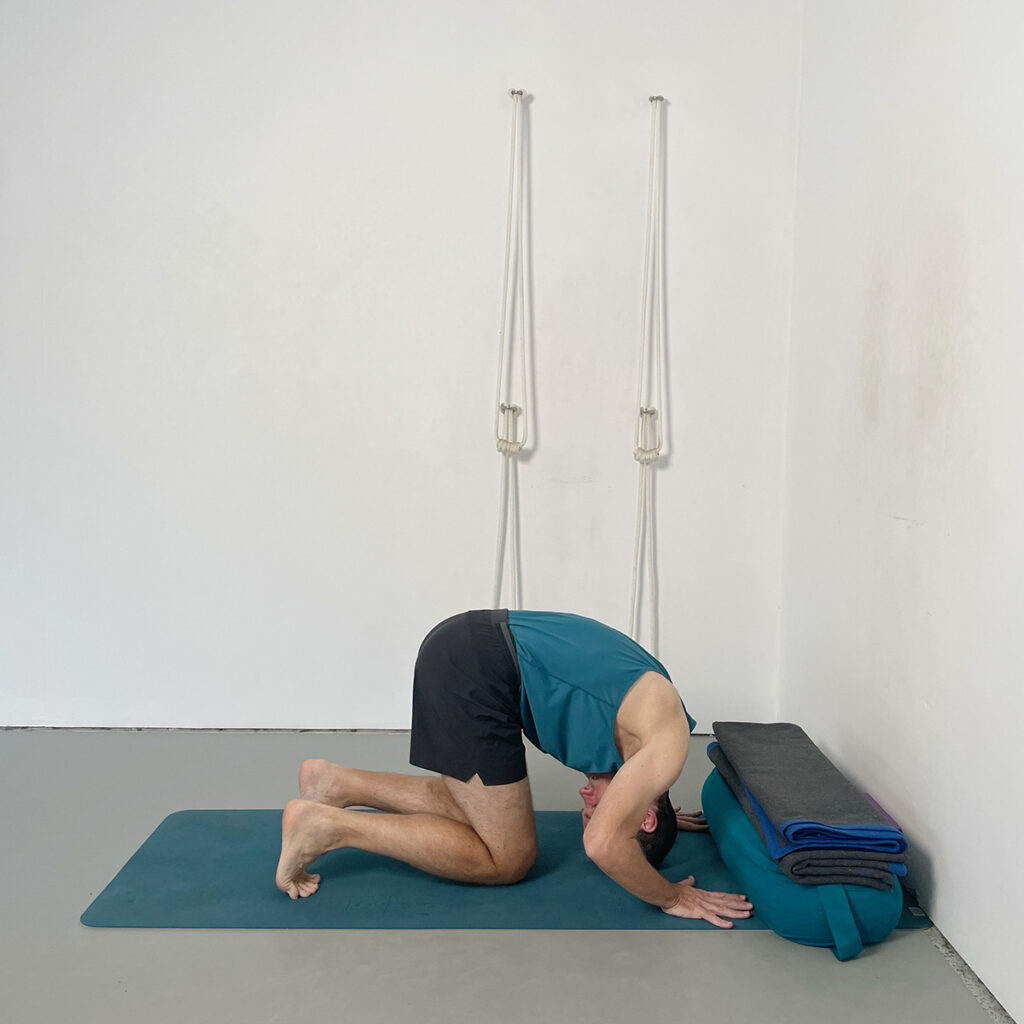 viparita. karani forward roll