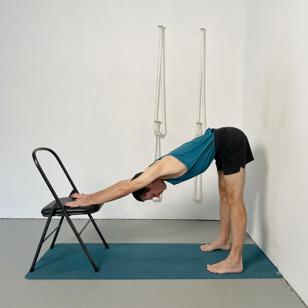 Ardha Uttanasana (Half Forward Bend) with Hands on Chair Seat